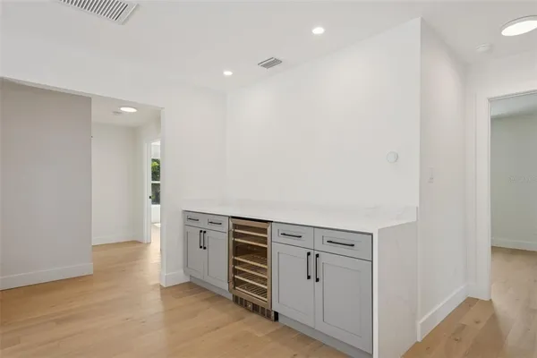 an empty room with wooden floor
