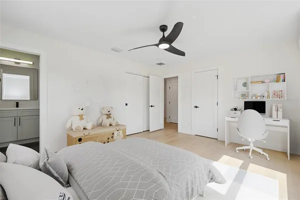 a bedroom with a bed and a chair