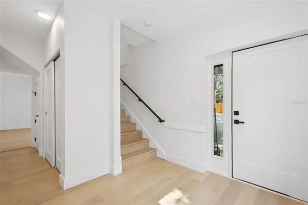 a view of entryway with wooden floor