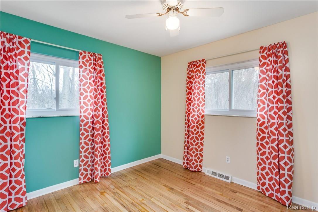 14384 Hess Road Holly, MI 48442 - Photo 16 of 30 2nd bedroom refinished floors and large windows