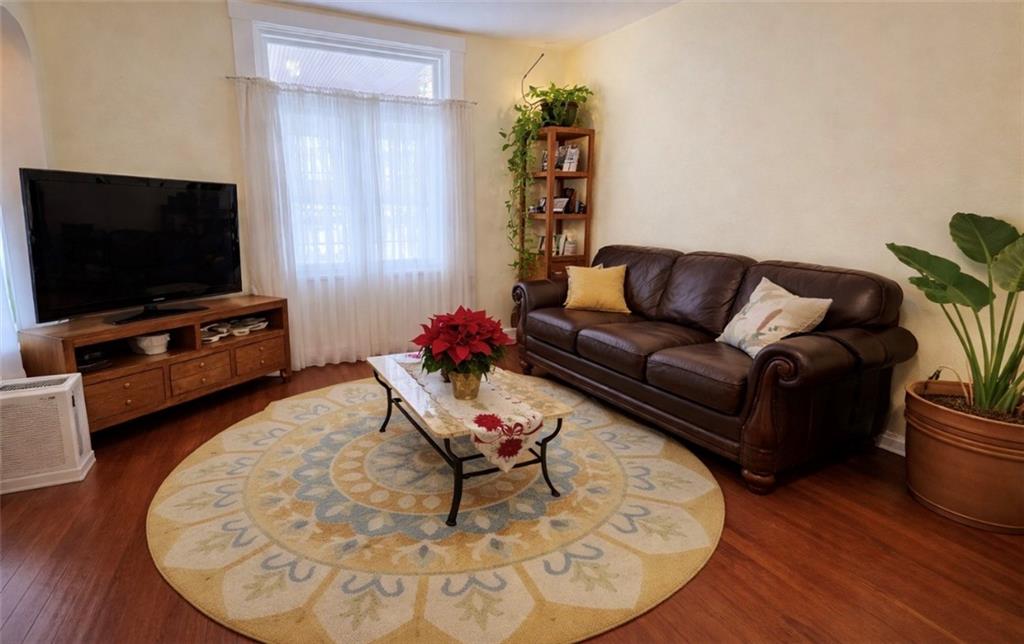 2219 Edgebrook Avenue Pittsburgh, PA 15226 - Photo 2 of 19 a living room with furniture and a flat screen tv