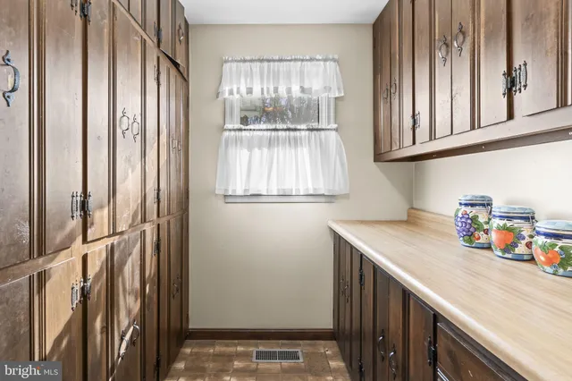 a kitchen with stainless steel appliances granite countertop a stove sink and cabinets