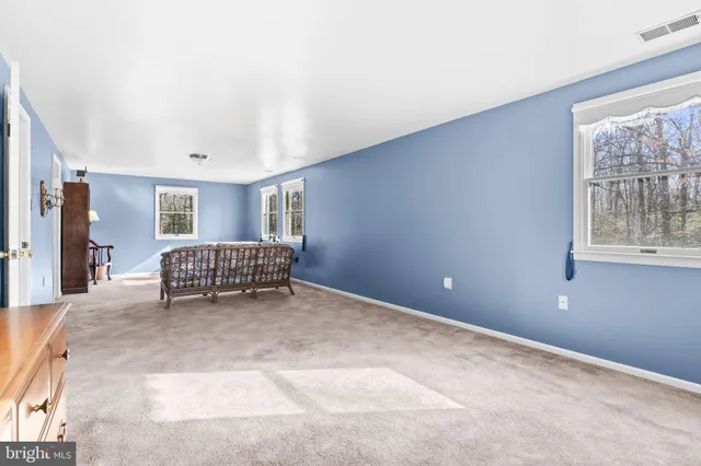 a view of livingroom with furniture and windows