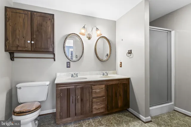 a room with a bed and a dresser