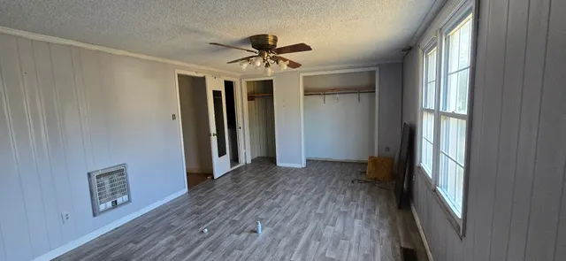 a view of entryway with wooden floor