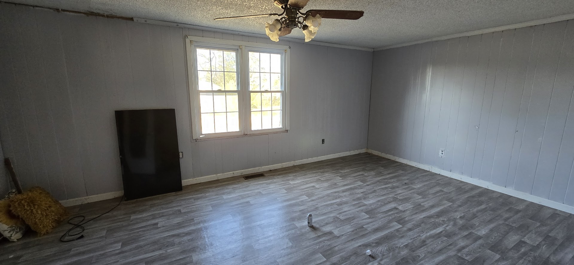 117 Pleasant View Road White Bluff, TN 37187 - Photo 12 of 21 an empty room with wooden floor a chandelier fan and windows