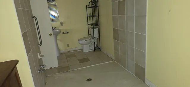 a bathroom with a glass shower door