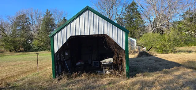 a view of backyard with green space