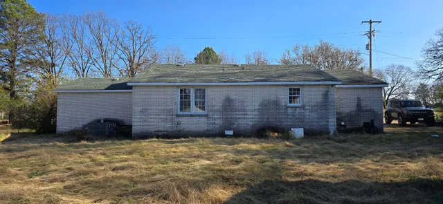 a view of a house with a yard and garage