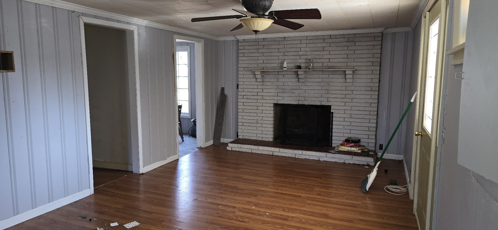 117 Pleasant View Road White Bluff, TN 37187 - Photo 8 of 21 a view of an empty room with wooden floor and a fireplace