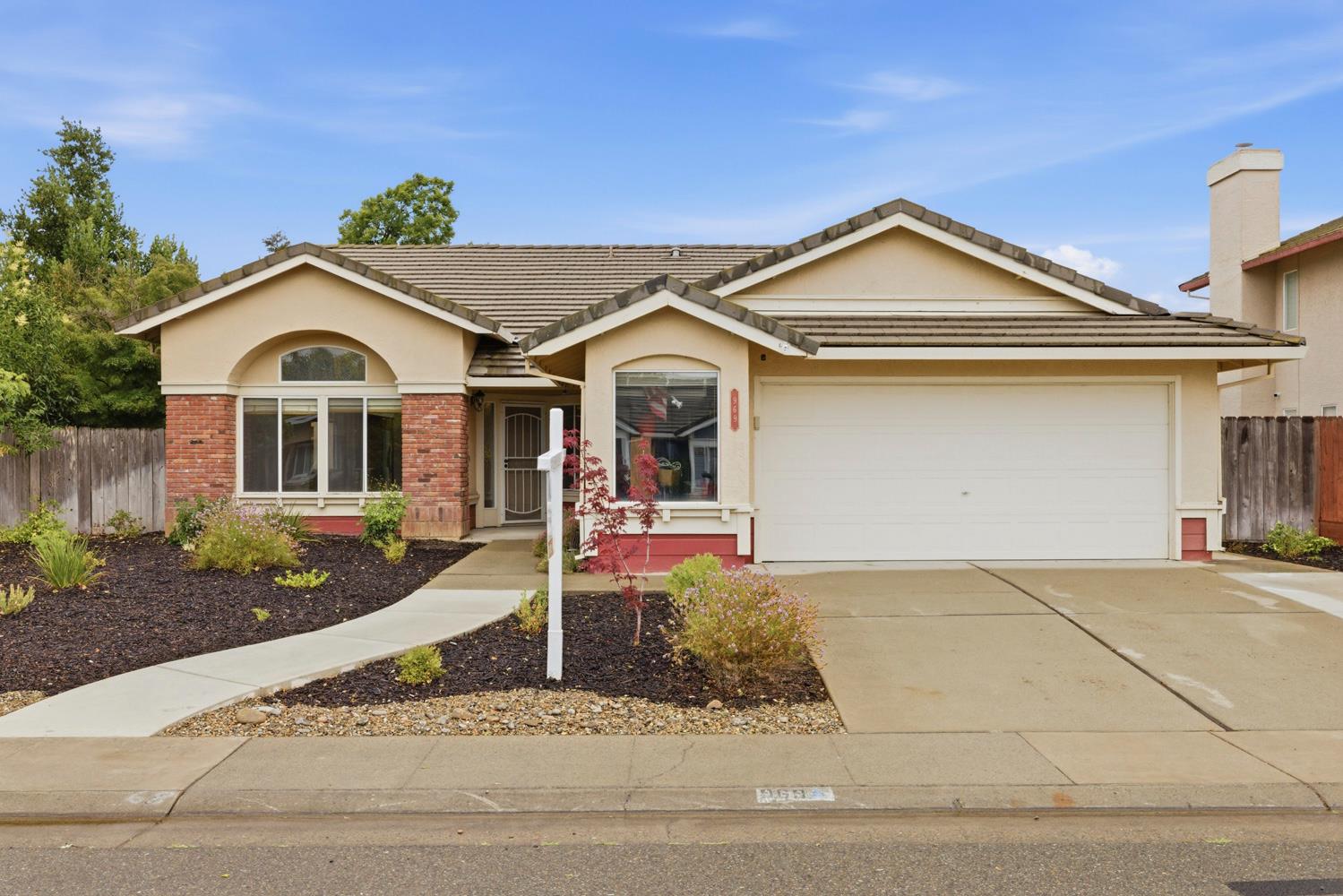 969 Colson Way Galt, CA 95632 - Photo 1 of 38 a front view of a house with porch and yard