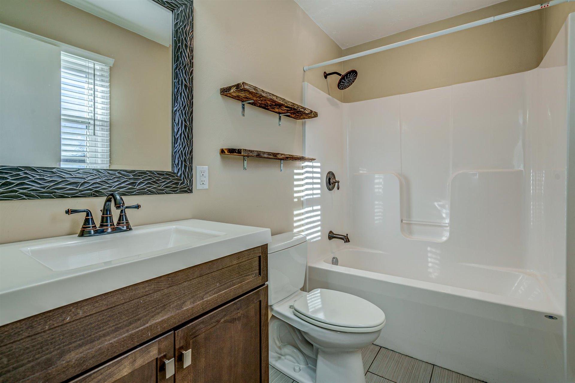 398 Jamestown Road Rocky Mount, VA 24151 - Photo 21 of 42 a bathroom with a sink toilet and shower