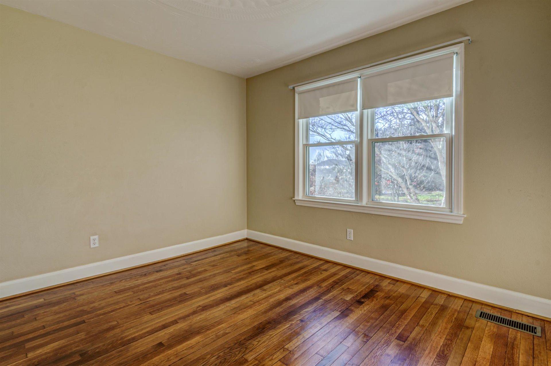 398 Jamestown Road Rocky Mount, VA 24151 - Photo 22 of 42 a view of a room with wooden floor and windows
