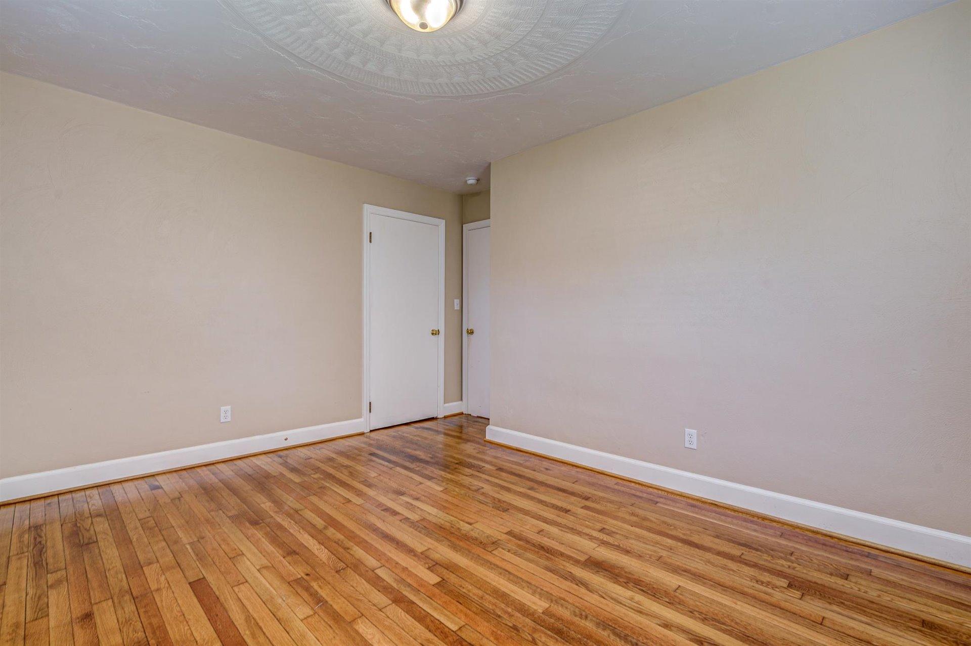 398 Jamestown Road Rocky Mount, VA 24151 - Photo 26 of 42 a view of an empty room with wooden floor