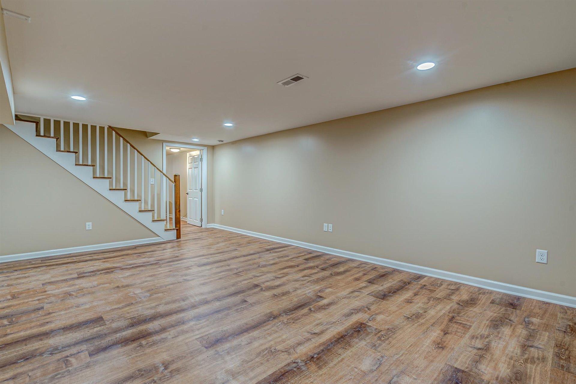 398 Jamestown Road Rocky Mount, VA 24151 - Photo 28 of 42 a view of room with stairs and wooden floor