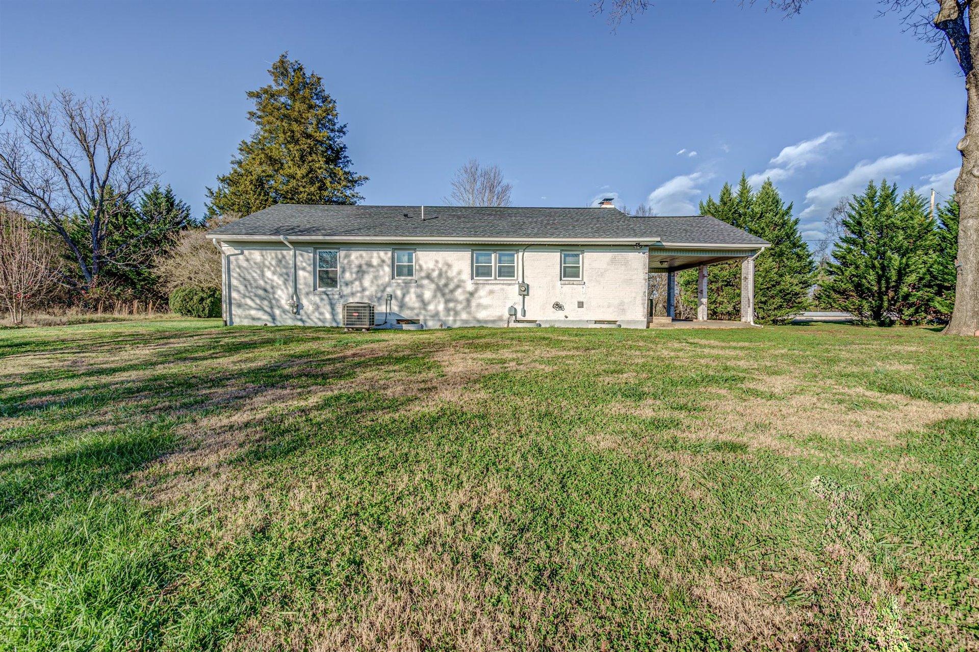 398 Jamestown Road Rocky Mount, VA 24151 - Photo 33 of 42 a front view of a house with a yard