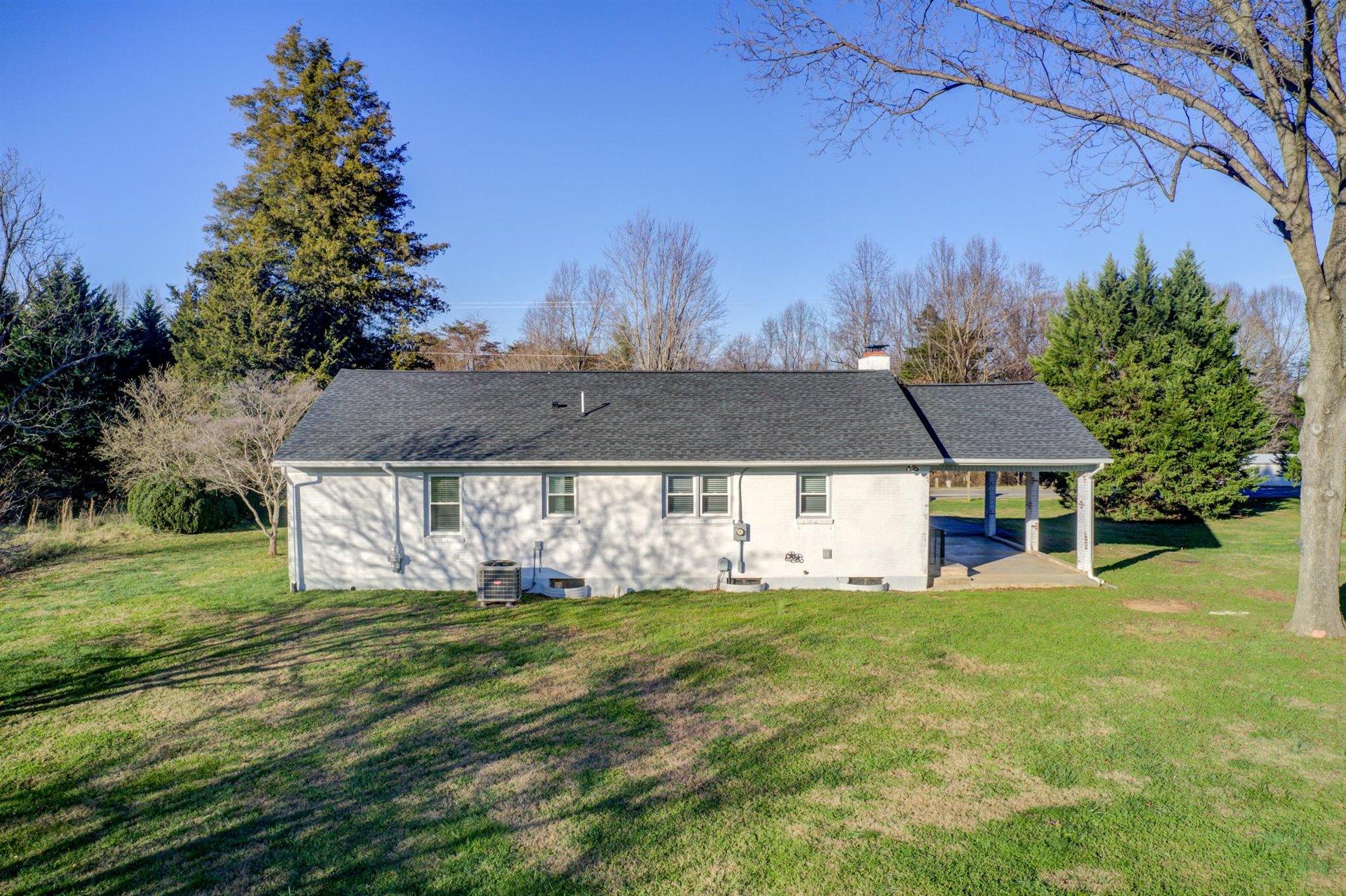 398 Jamestown Road Rocky Mount, VA 24151 - Photo 34 of 42 a view of a house with a big yard and large trees