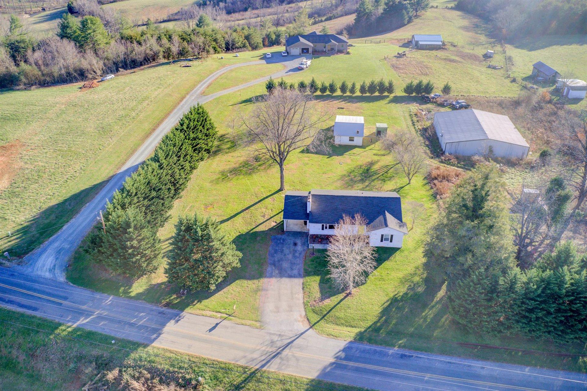 398 Jamestown Road Rocky Mount, VA 24151 - Photo 38 of 42 an aerial view of residential houses with outdoor space and swimming pool