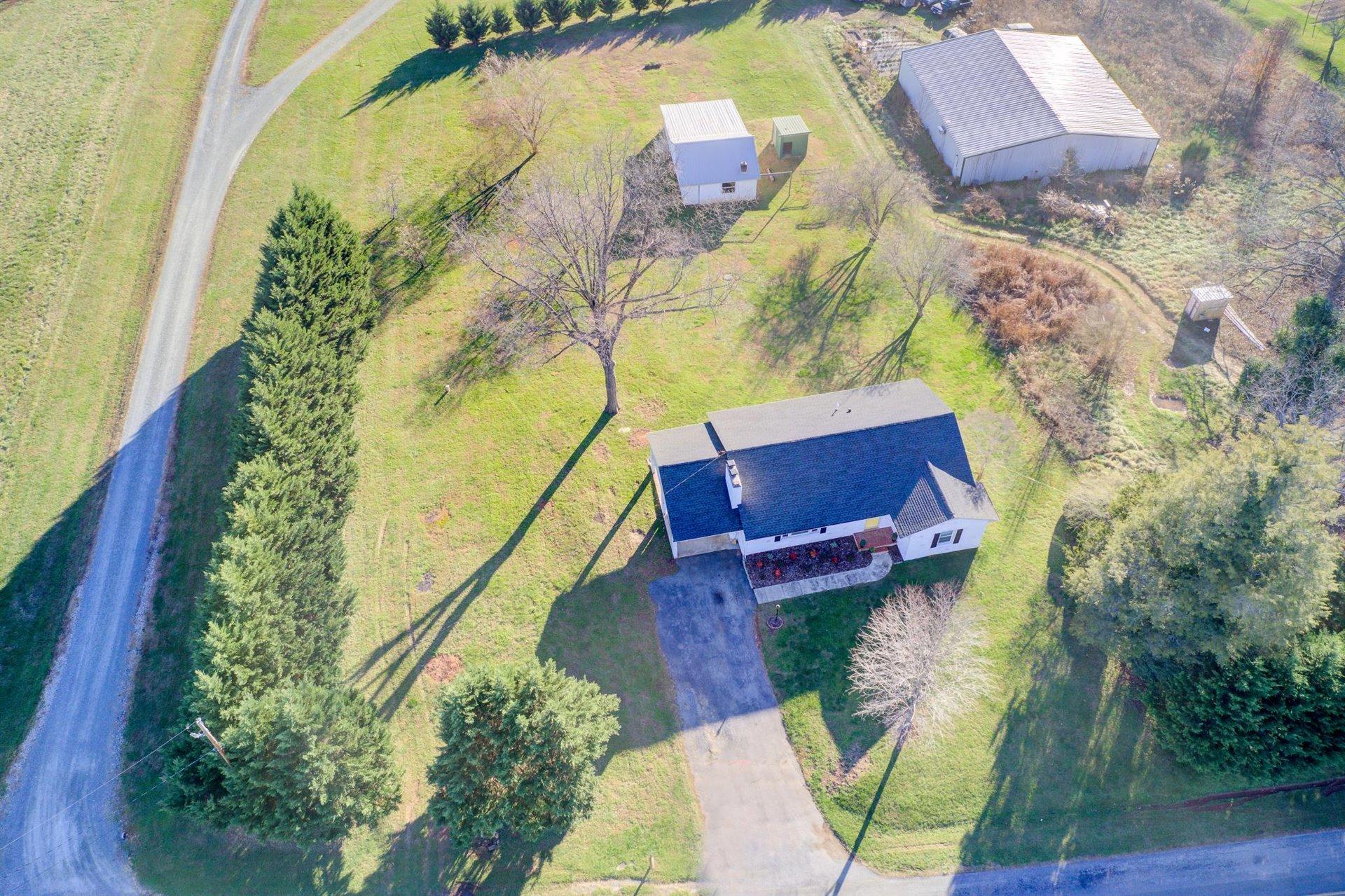 398 Jamestown Road Rocky Mount, VA 24151 - Photo 39 of 42 an aerial view of a house with a swimming pool