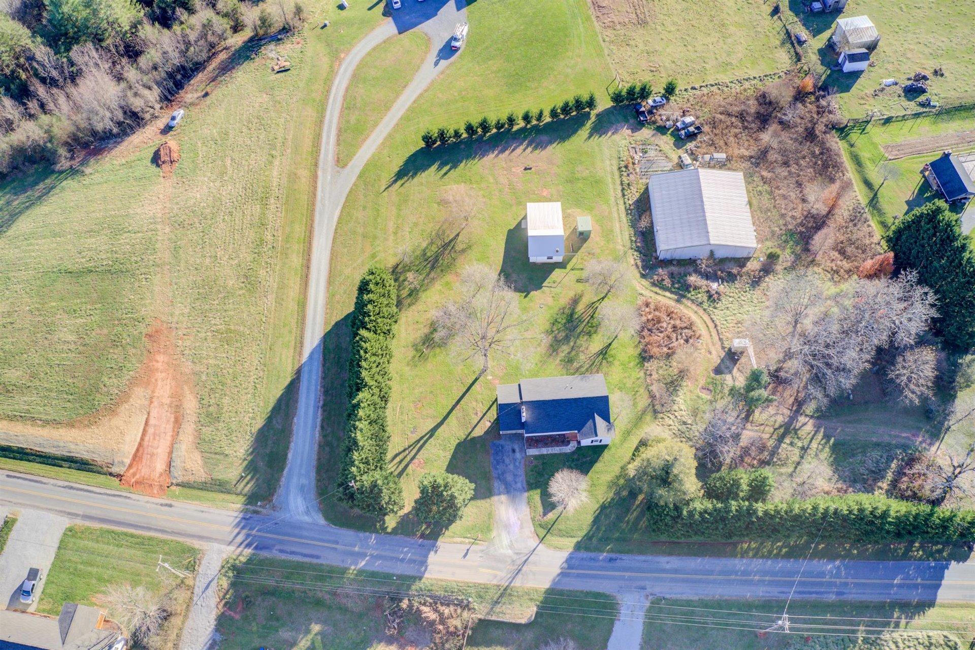 398 Jamestown Road Rocky Mount, VA 24151 - Photo 41 of 42 an aerial view of a house with a swimming pool