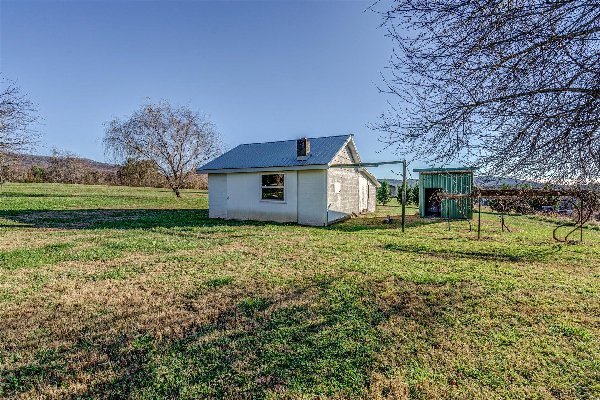 398 Jamestown Road Rocky Mount, VA 24151 - Photo 9 of 42 a front view of a house with a garden