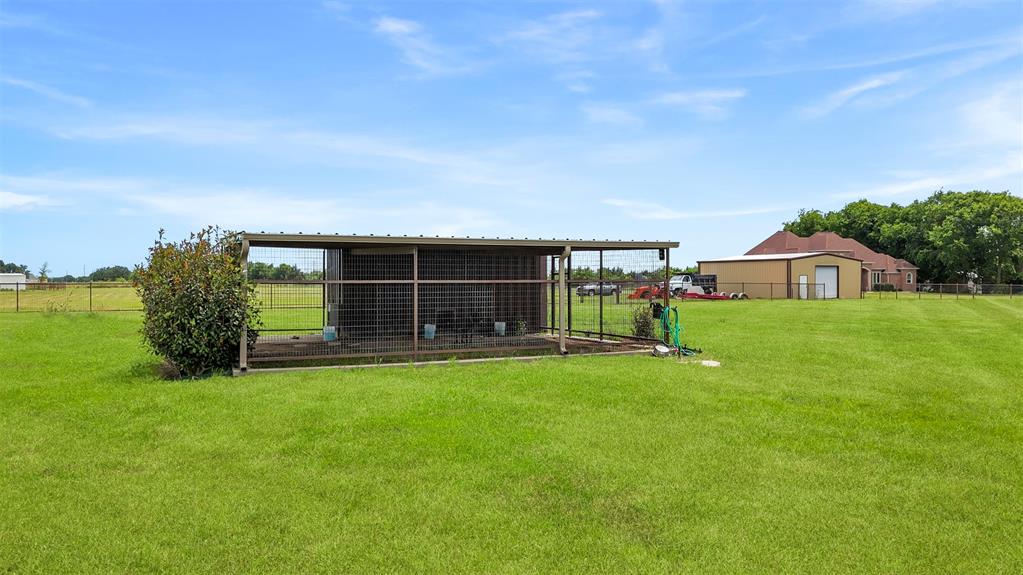 219 Mohundro Road Ferris, TX 75125 - Photo 37 of 40 a view of a house with a yard and sitting area