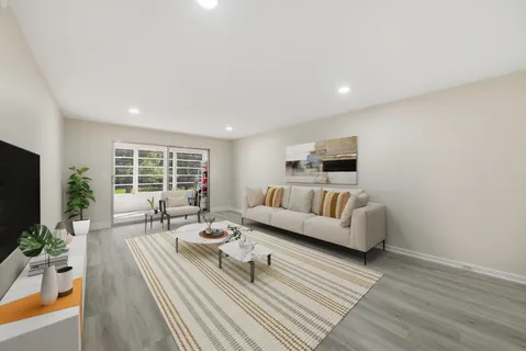 a living room with furniture fireplace and flat screen tv