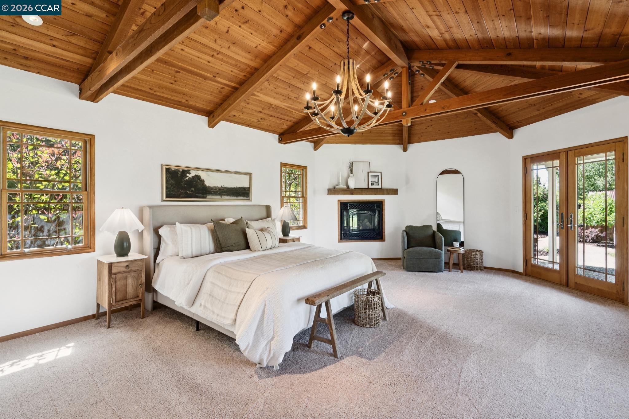 20 Santa Rita Drive Walnut Creek, CA 94596 - Photo 14 of 44 a spacious bedroom with a bed couch and flat tv screen