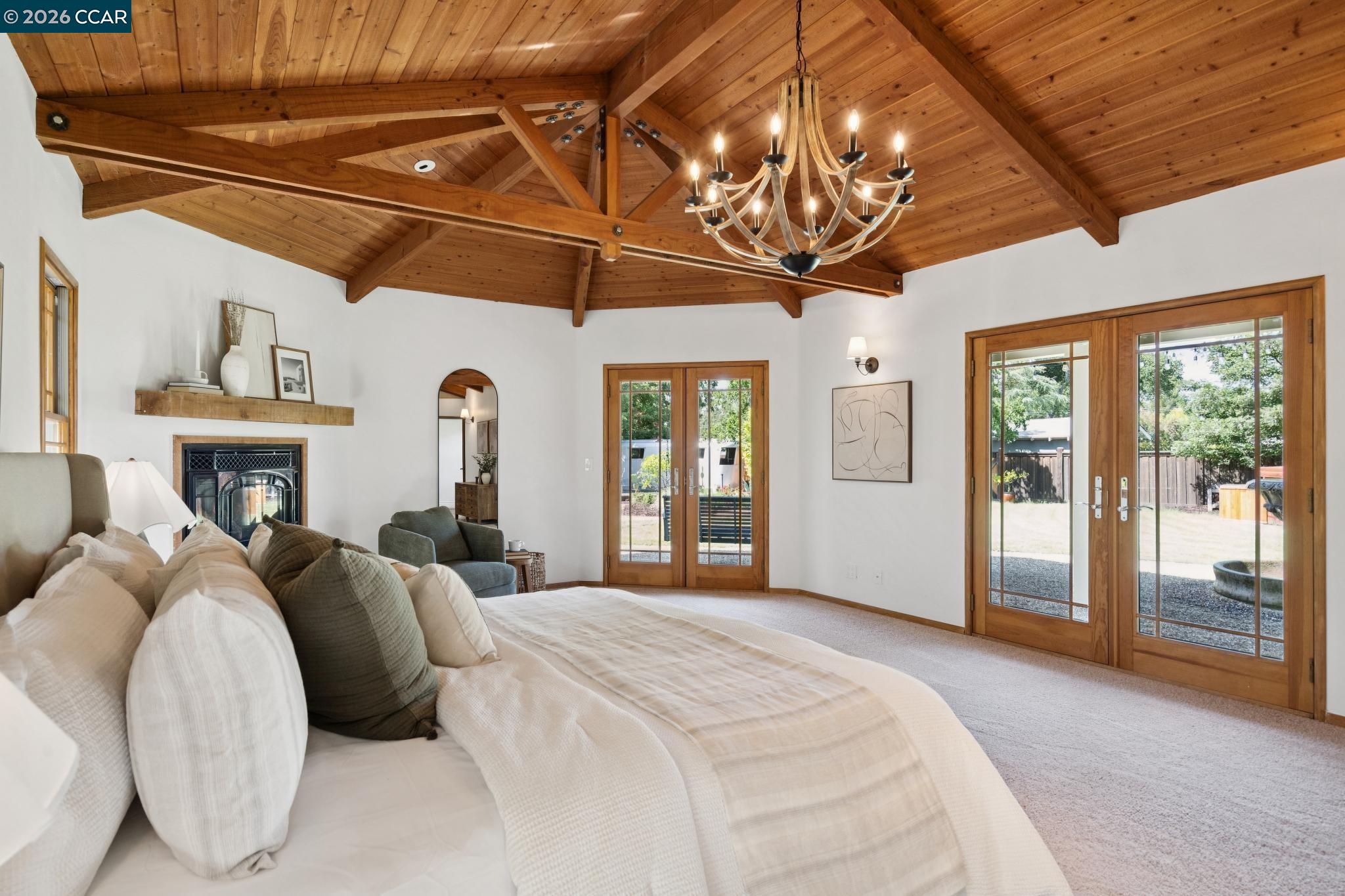 20 Santa Rita Drive Walnut Creek, CA 94596 - Photo 15 of 44 a bedroom with a large bed and a chandelier
