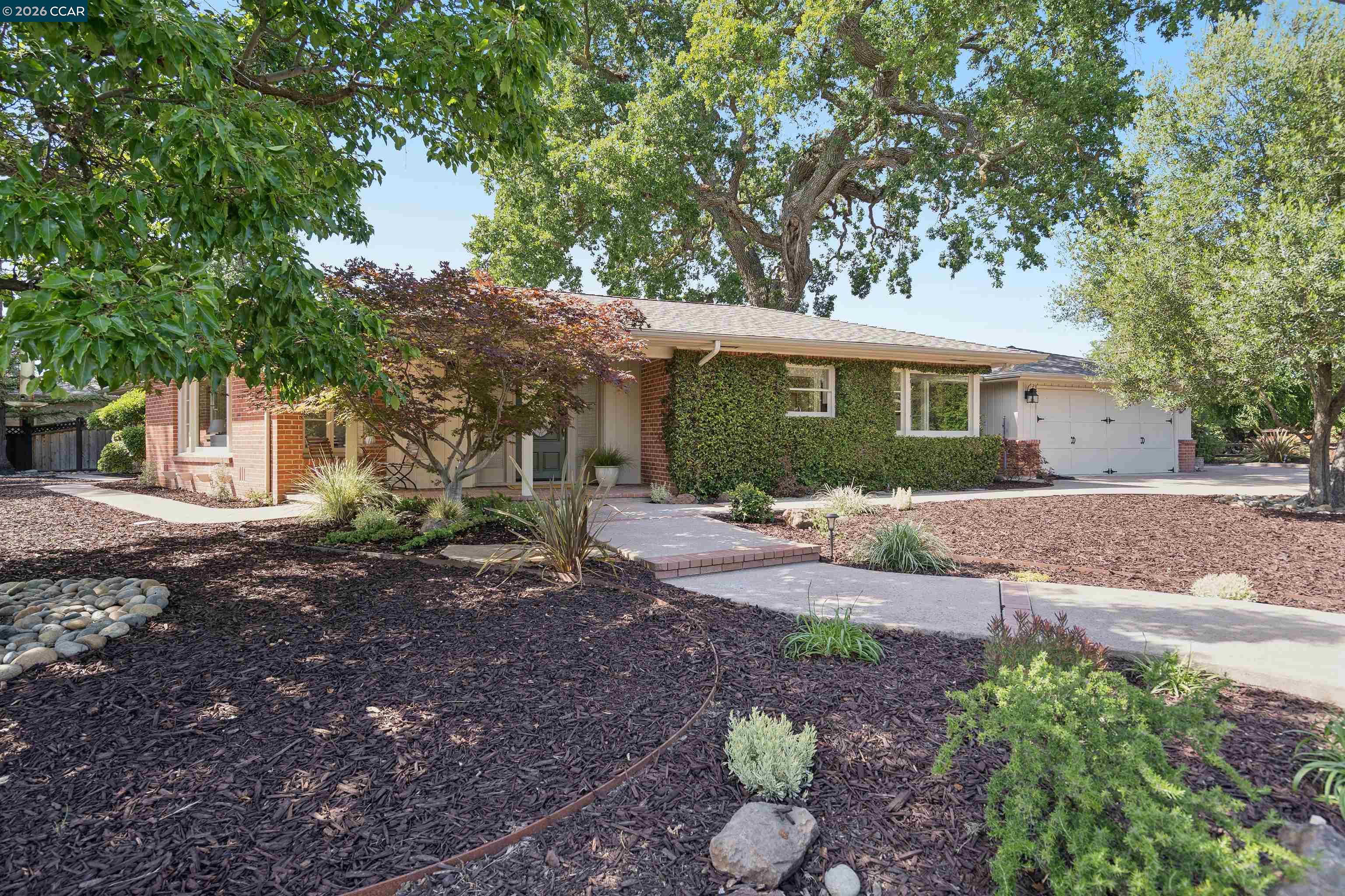 20 Santa Rita Drive Walnut Creek, CA 94596 - Photo 2 of 44 a front view of a house with a yard and potted plants