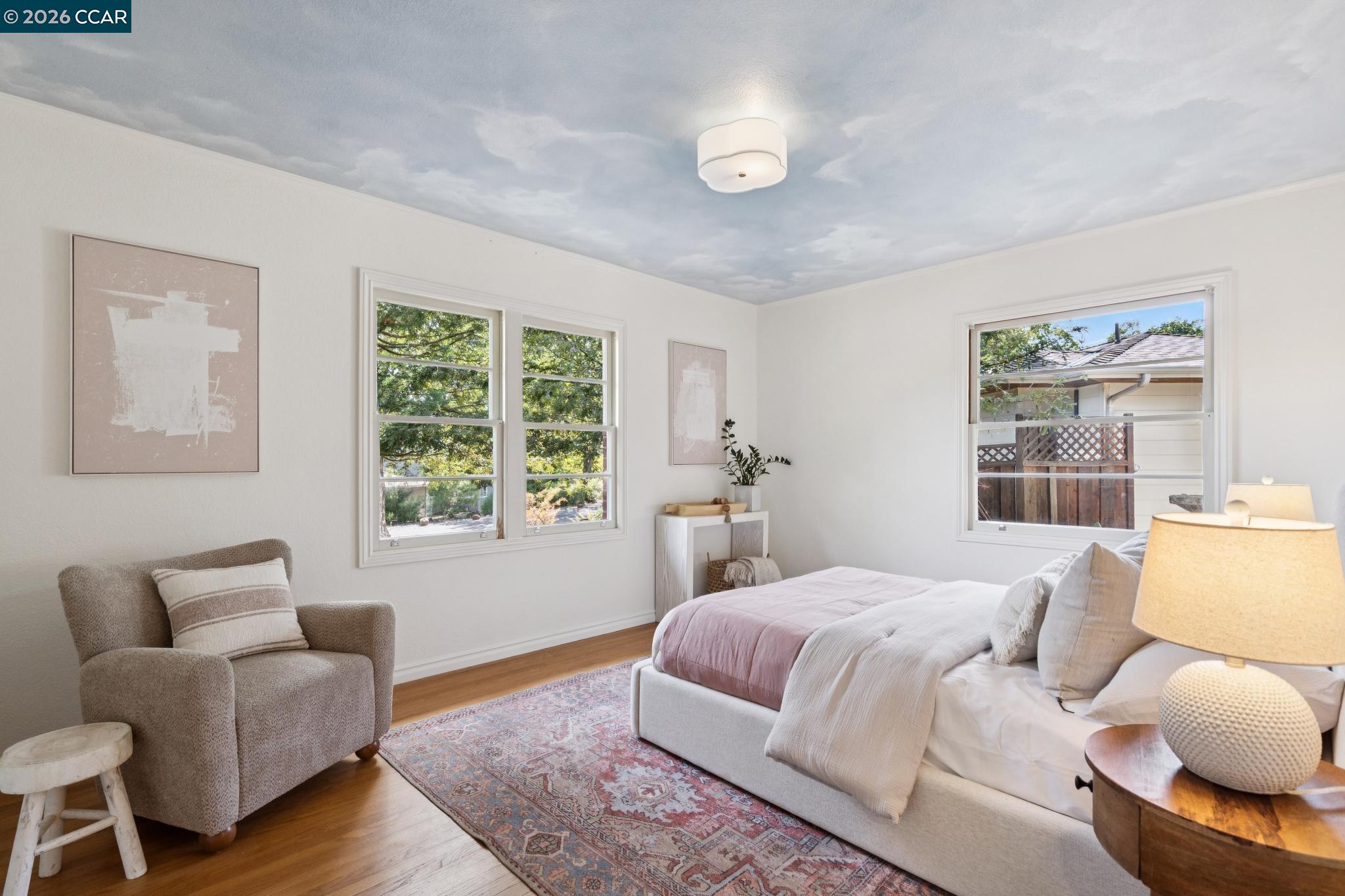 20 Santa Rita Drive Walnut Creek, CA 94596 - Photo 22 of 44 a bedroom with a bed and wooden floor