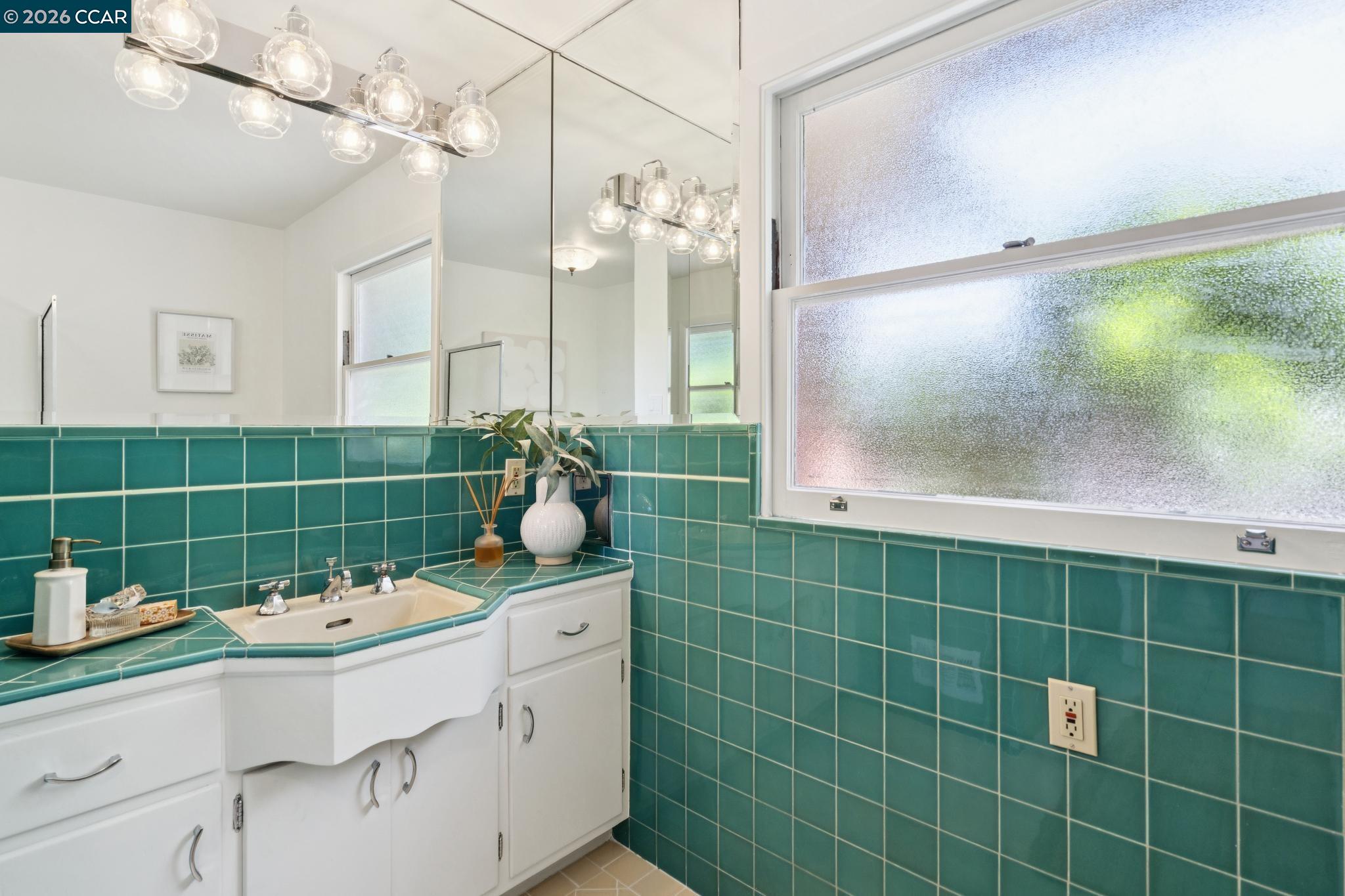 20 Santa Rita Drive Walnut Creek, CA 94596 - Photo 25 of 44 a bathroom with a sink mirror and shower