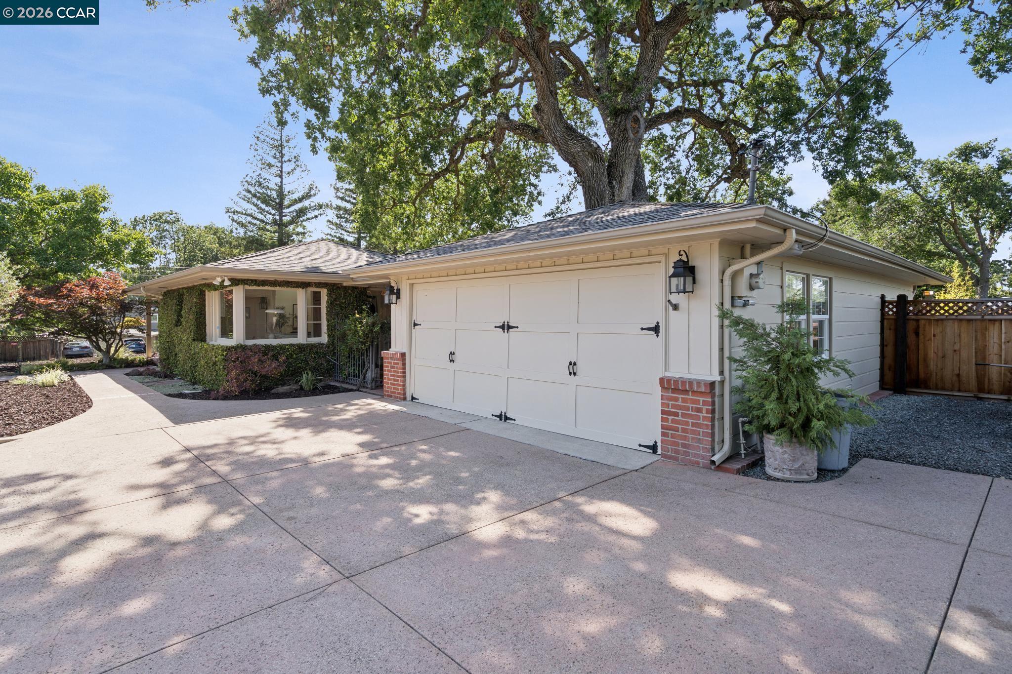 20 Santa Rita Drive Walnut Creek, CA 94596 - Photo 3 of 44 a view of a house with a yard and potted plants