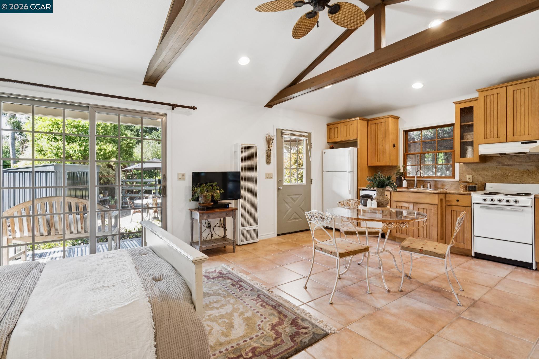 20 Santa Rita Drive Walnut Creek, CA 94596 - Photo 37 of 44 a living room with furniture a flat screen tv and a floor to ceiling window