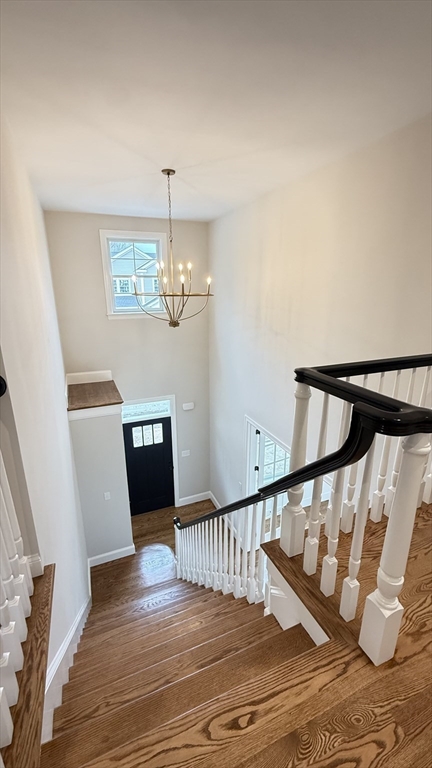 18 Powder House Lane, Unit 5 Walpole, MA 02032 - Photo 11 of 20 a view of entryway and hall with wooden floor
