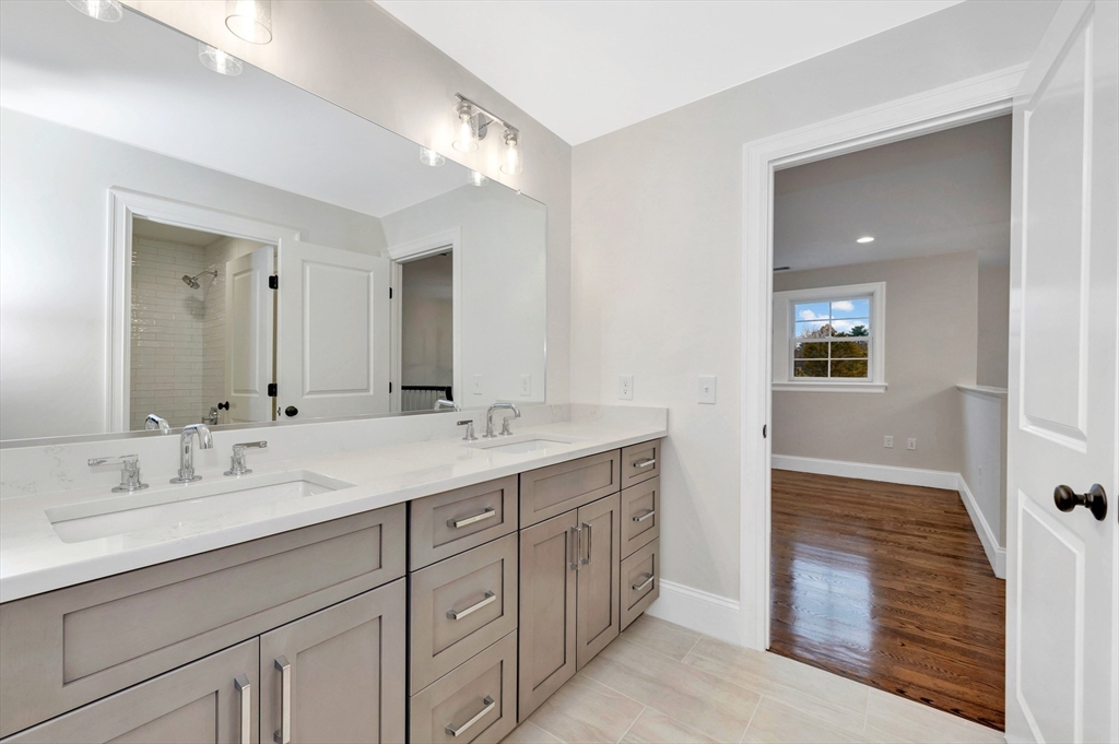 18 Powder House Lane, Unit 5 Walpole, MA 02032 - Photo 2 of 20 a spacious bathroom with a double vanity sink double and mirror