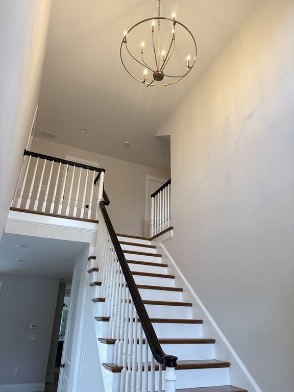 18 Powder House Lane, Unit 5 Walpole, MA 02032 - Photo 6 of 20 a view of staircase with wooden floor and white walls