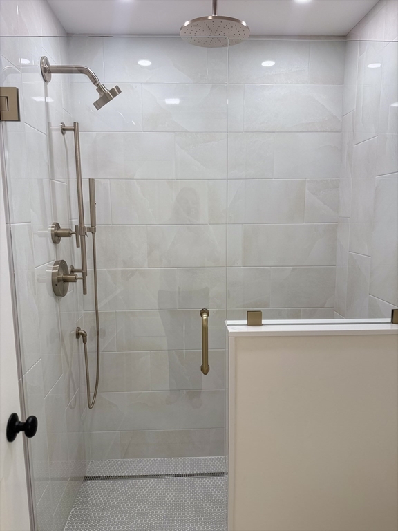 18 Powder House Lane, Unit 5 Walpole, MA 02032 - Photo 8 of 20 a bathroom with a shower