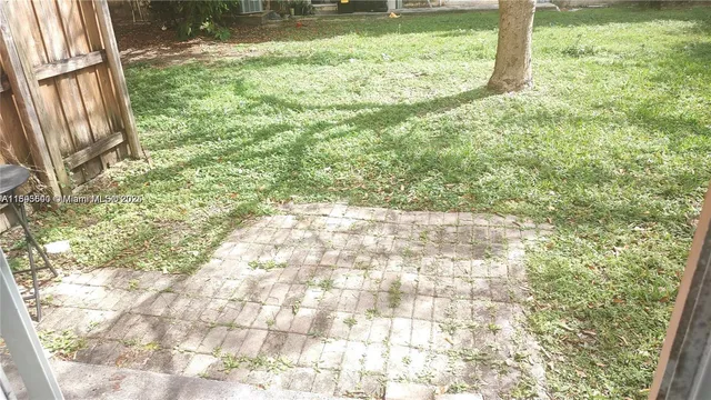 a view of a lake with houses in the back