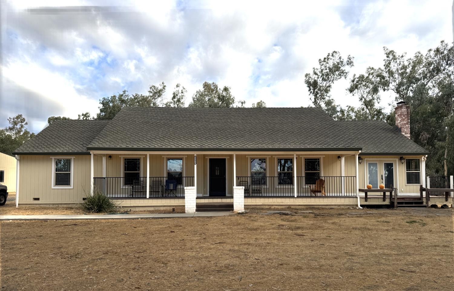 12415 Clay Station Road Herald, CA 95638 - Photo 1 of 1 front view of a house with a lots of white windows