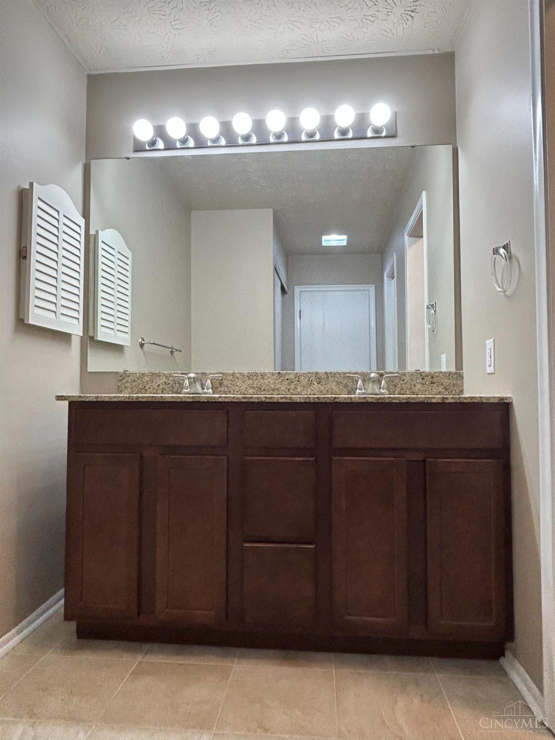 8122 Timbertree Way Beckett Ridge, OH 45069 - Photo 17 of 36 Full master bathroom recently upgraded with tile floor, double sinks vanity with granite countertop.