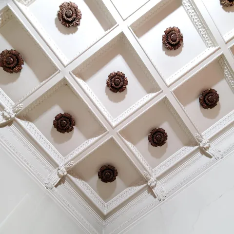 a black white and white photo of a living room