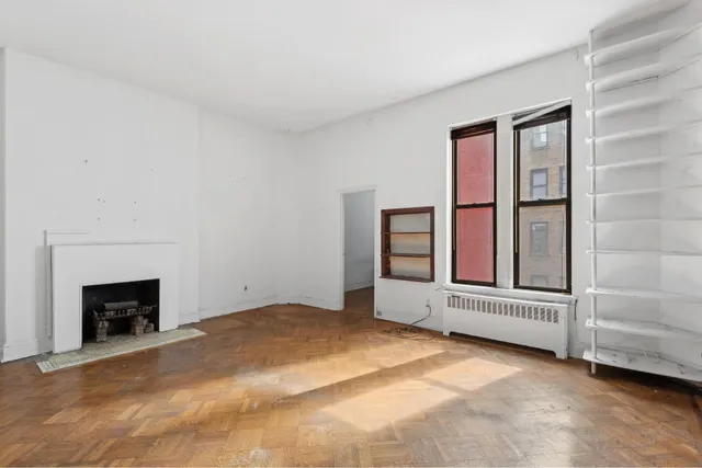 an empty room with fireplace