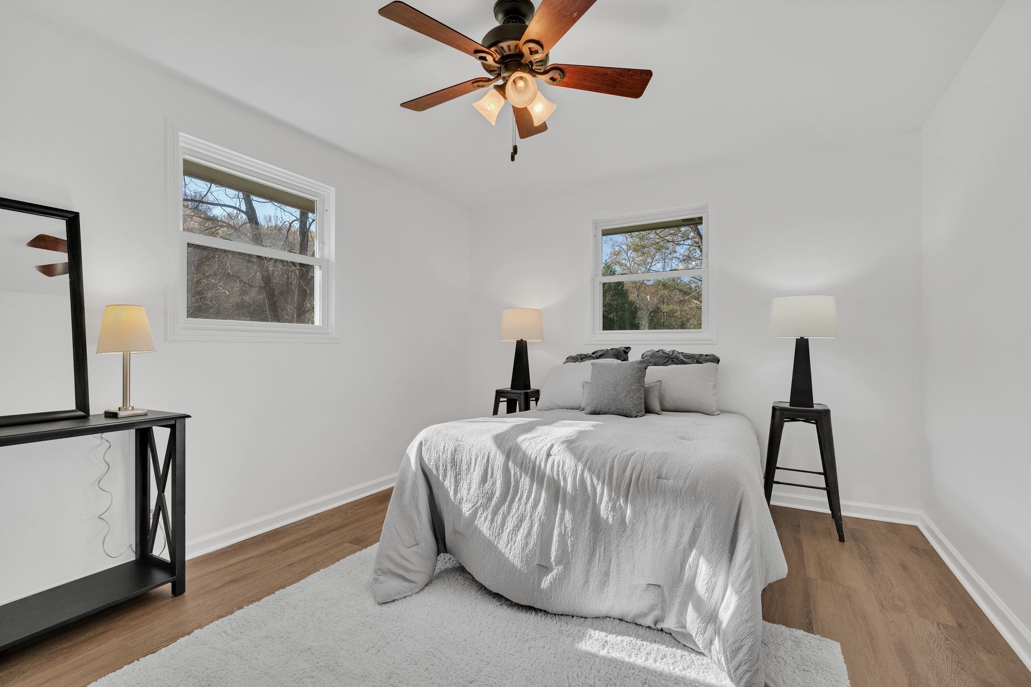 2173 Highway 48 South Dickson, TN 37055 - Photo 17 of 30 a bedroom with a bed and a chandelier