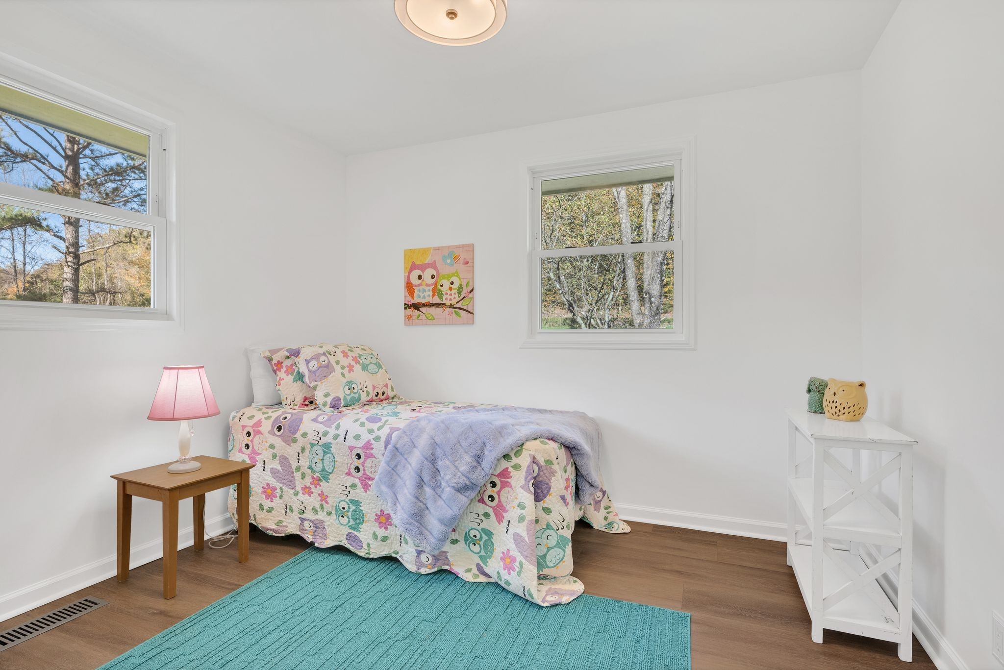 2173 Highway 48 South Dickson, TN 37055 - Photo 20 of 30 a bedroom with a bed and wooden floor