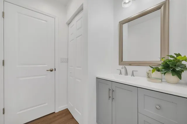 a bathroom with a sink and a mirror