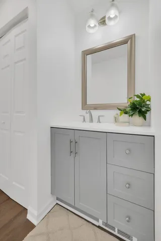 a bathroom with a sink and a mirror