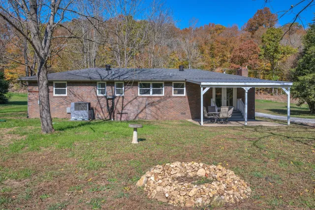 a view of swimming pool with an outdoor space and seating area