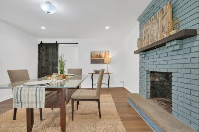 a dining room with furniture and window