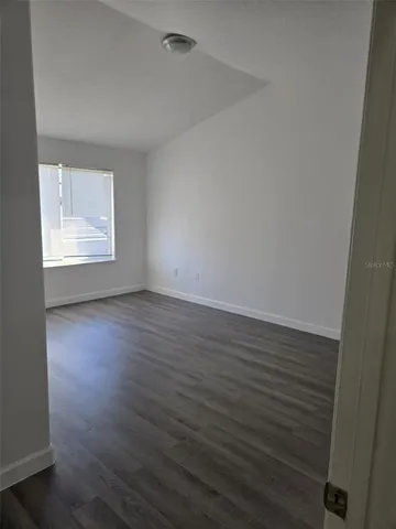 a bathroom with a granite countertop toilet and a shower